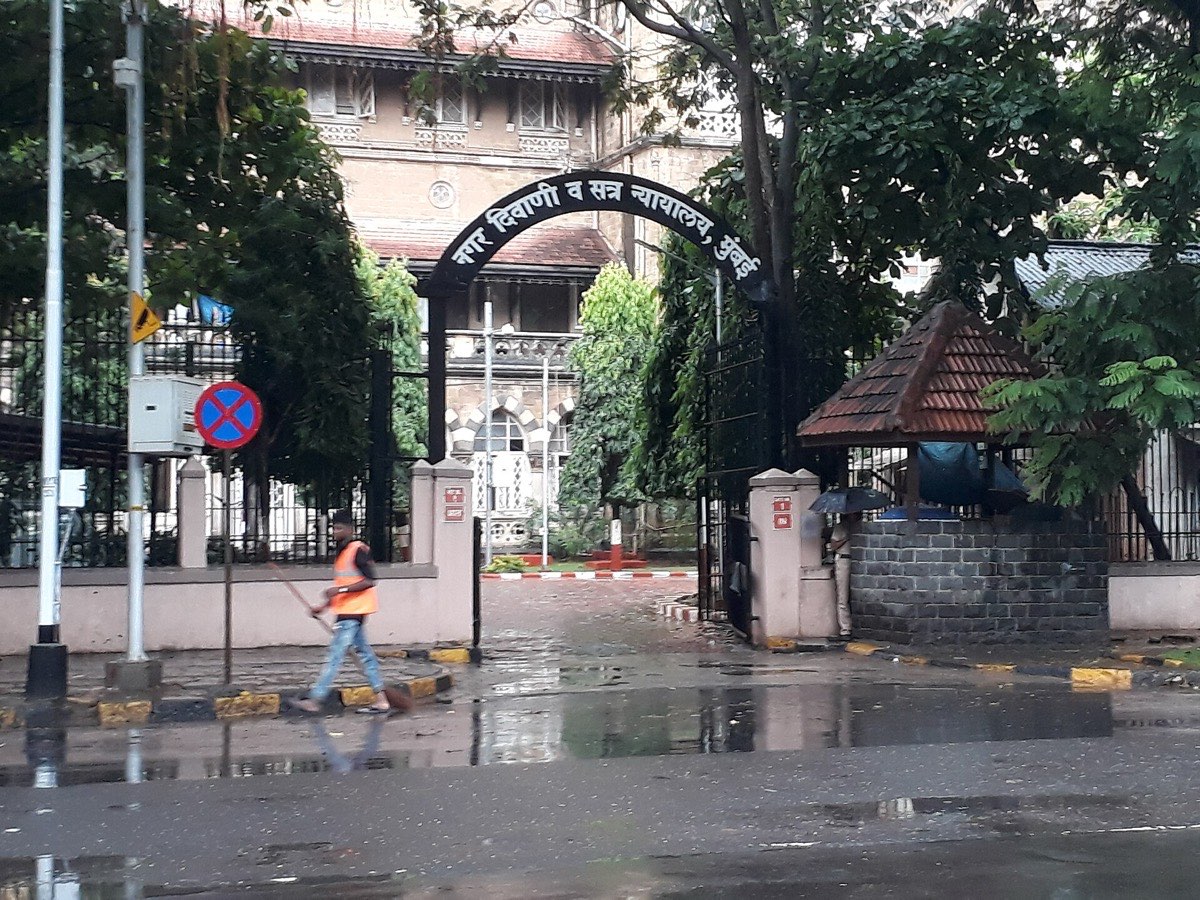 The arched gateway of the City Civil and Sessions Court, Mumbai, after rain